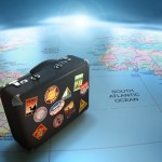 Vintage suitcase over world map